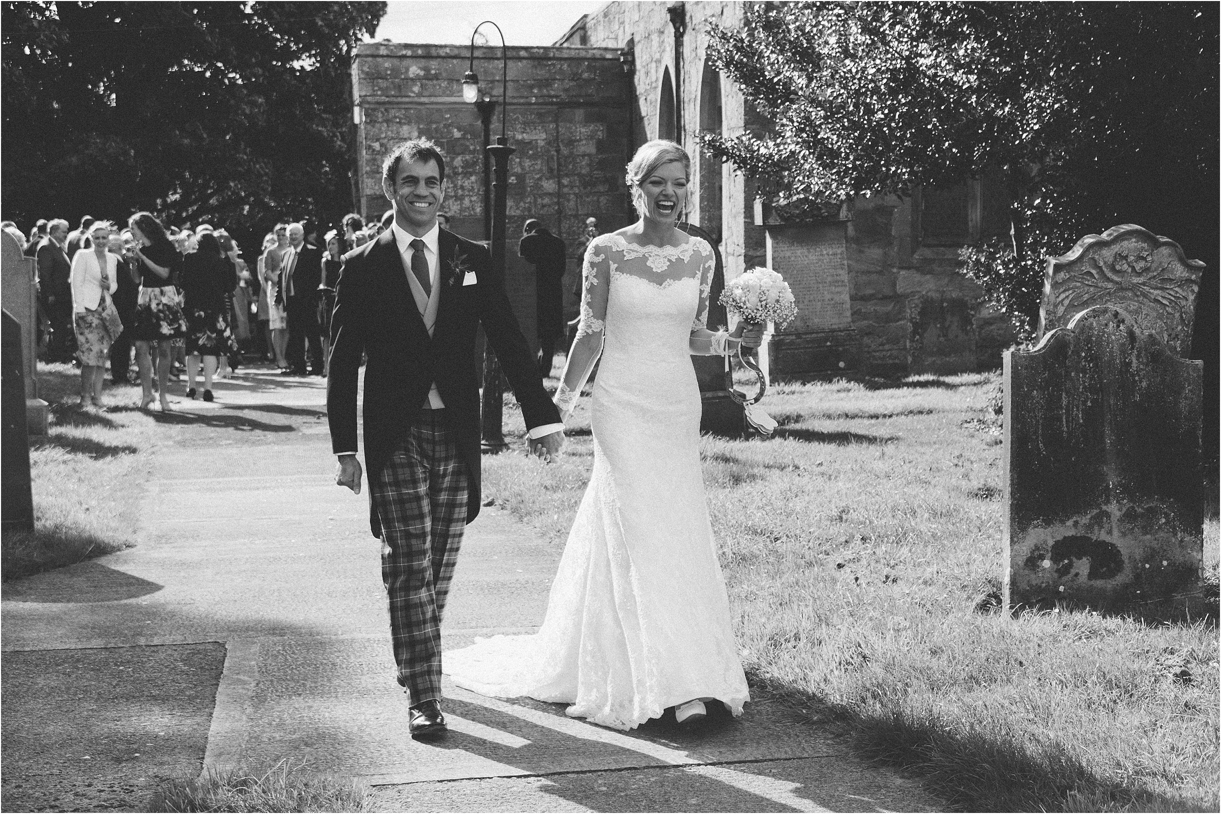 bride and groom leaving embleton church wedding northumberland